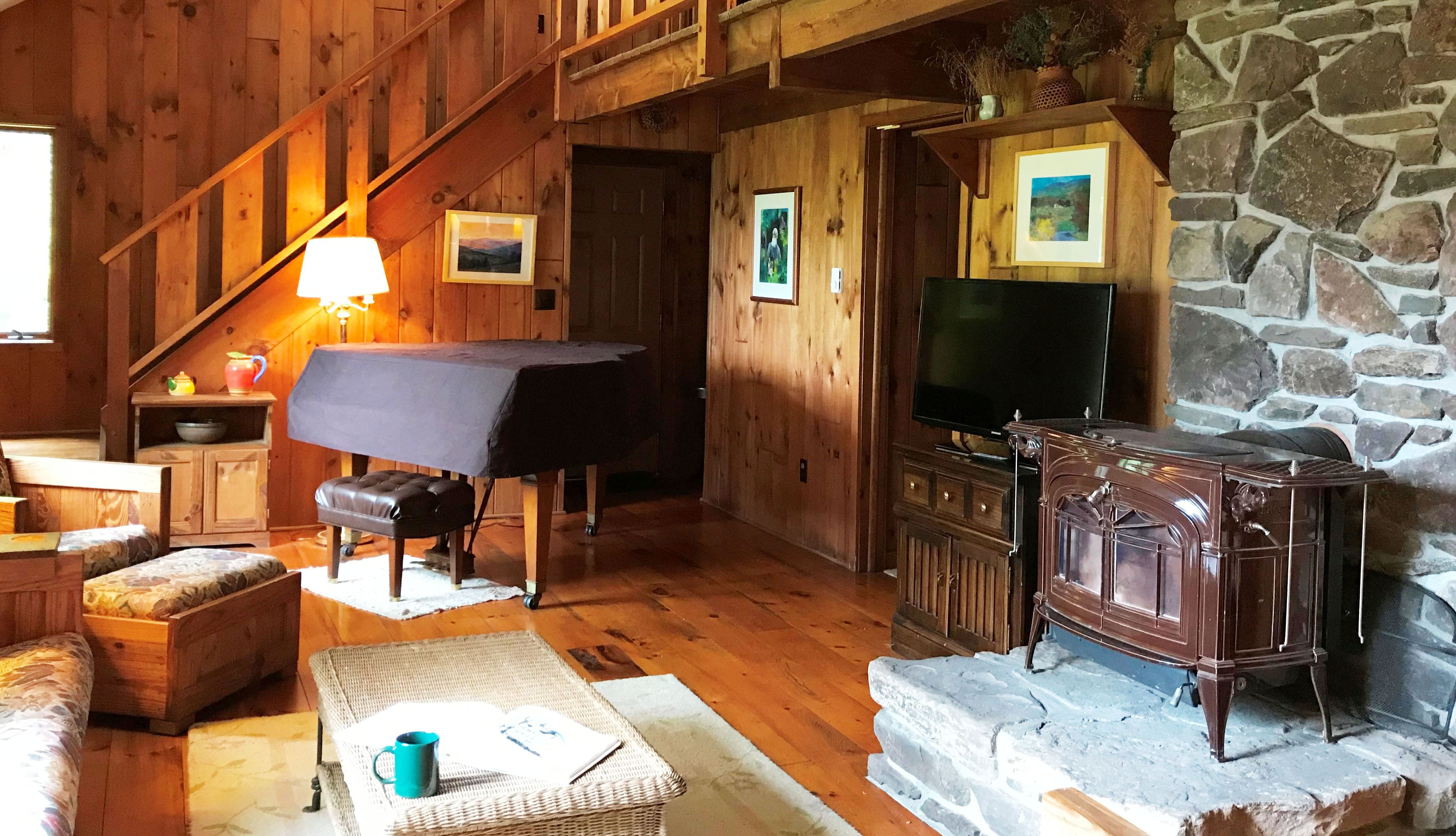 Living Space with TV, woodstove, and piano1