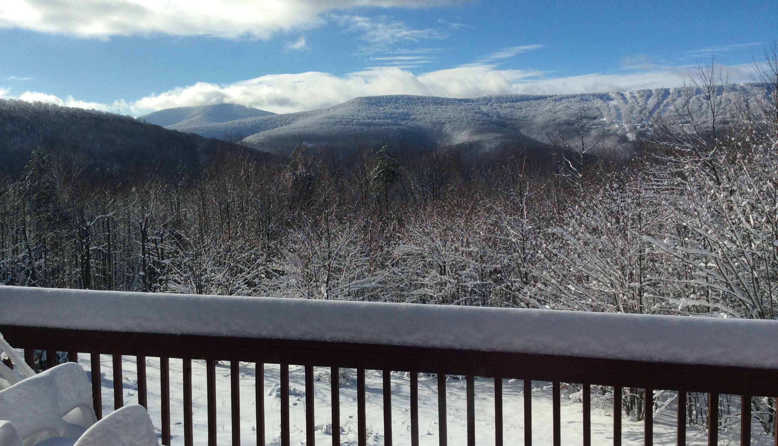 The deck and the mountains in the snow!